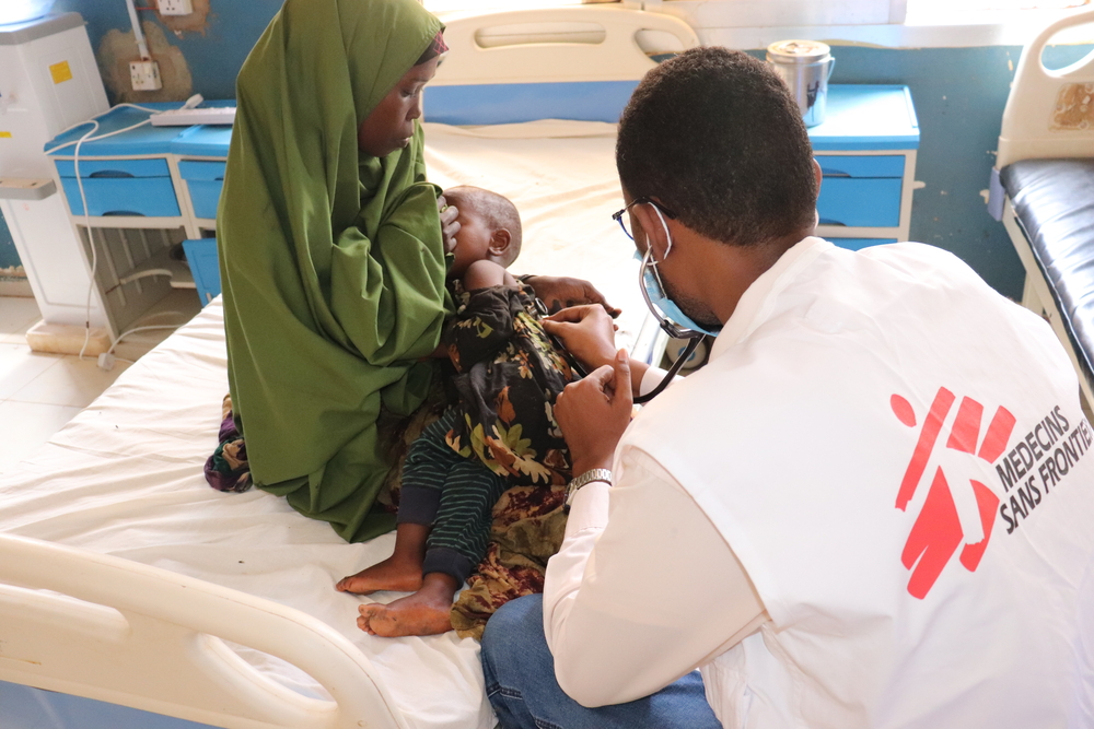 MSF Physician Doctor Ahmed Ilyas examining a baby inside an MSF supported Bay Regionl Hospital in Baidoa, SW State, Somalia.