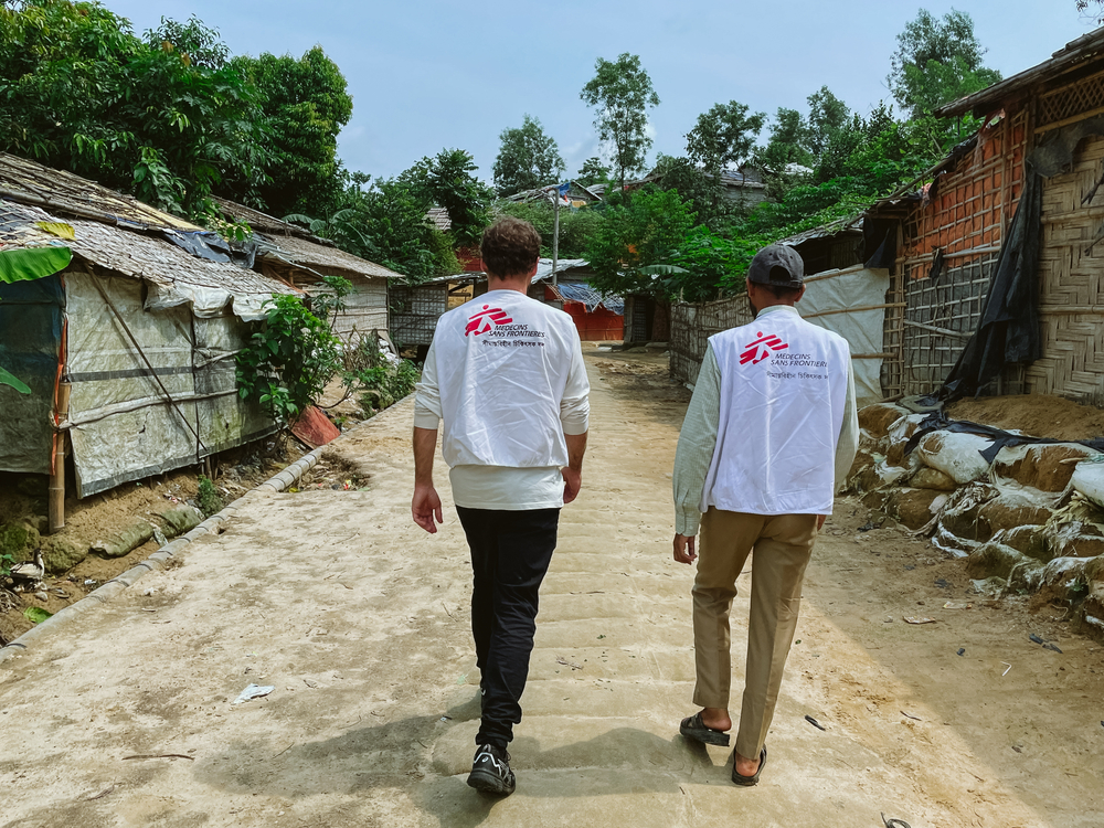 Two MSF staff walking through the Bangladesh refugee camps.